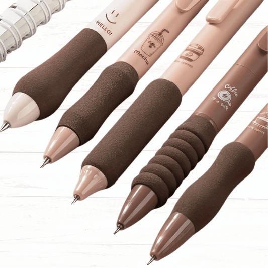 Set of pens with brown and beige accents on a white background