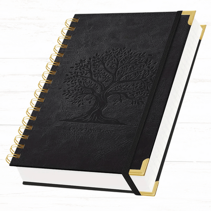 Black notebook with embossed tree design on a white background